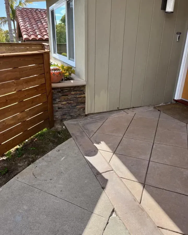 After view of a clean and cleared side passage and patio area following professional garden clearance service