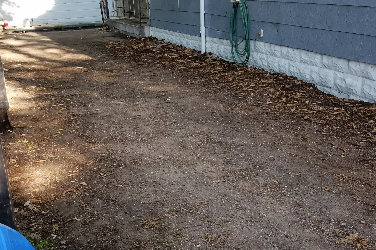 After view of a clean and cleared narrow garden pathway following professional rubbish removal and clearance service