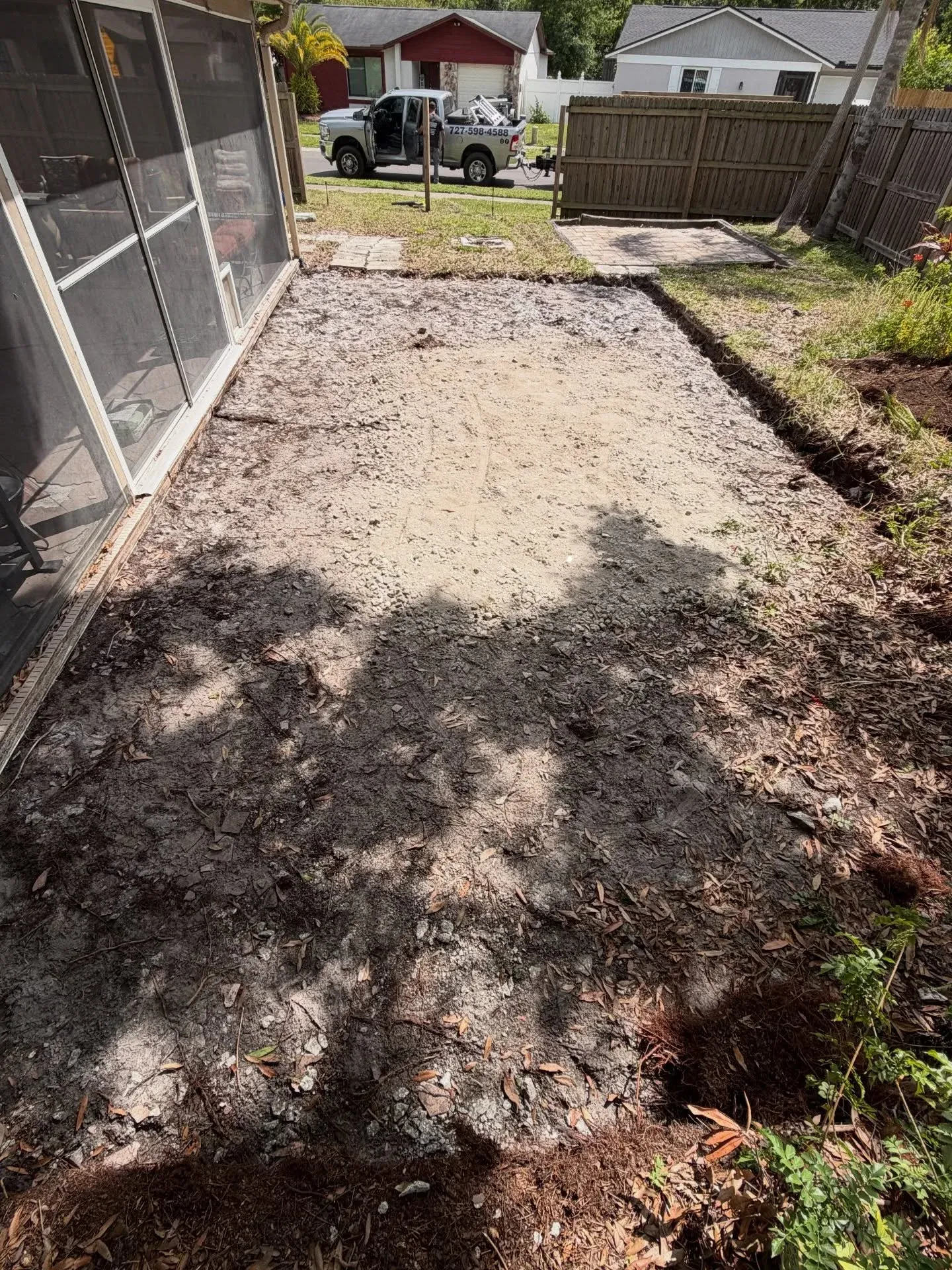 After view of a clean and empty garage with smooth concrete floor following professional rubbish and rubble removal